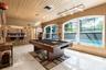 Where all the fun happens! The Florida Room. Great space for entertaining. New Large Custom Windows 2025. Eat at Pass Through Bar, Modern Slider Door