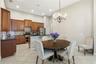 Open kitchen with 42" cabinetry, a gas range, and expanded pantry