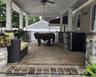 Covered patio featuring a ceiling fan, recessed lighting, and a stone-clad outdoor kitchen area