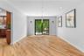 Unfurnished dining area featuring light wood finished floors, baseboards, and recessed lighting