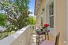 The primary retreat serves as a private sanctuary, featuring a charming Juliet balcony (virtually staged)