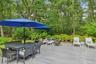 Wooden terrace featuring outdoor lounge area and outdoor dining space