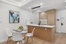 Kitchen featuring a sink, a peninsula, light wood-style flooring, recessed lighting, and light countertops