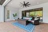 Covered patio offers protection from the Florida sun when needed and includes a hurricane rolldown shutter.