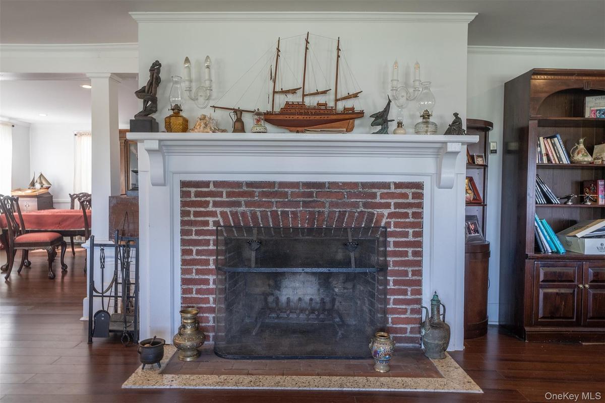 You can see the Craftsmanship with this wood burning fireplace and classic white mantel when you walk in the front door.