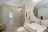 Full bathroom with vanity and a shower stall