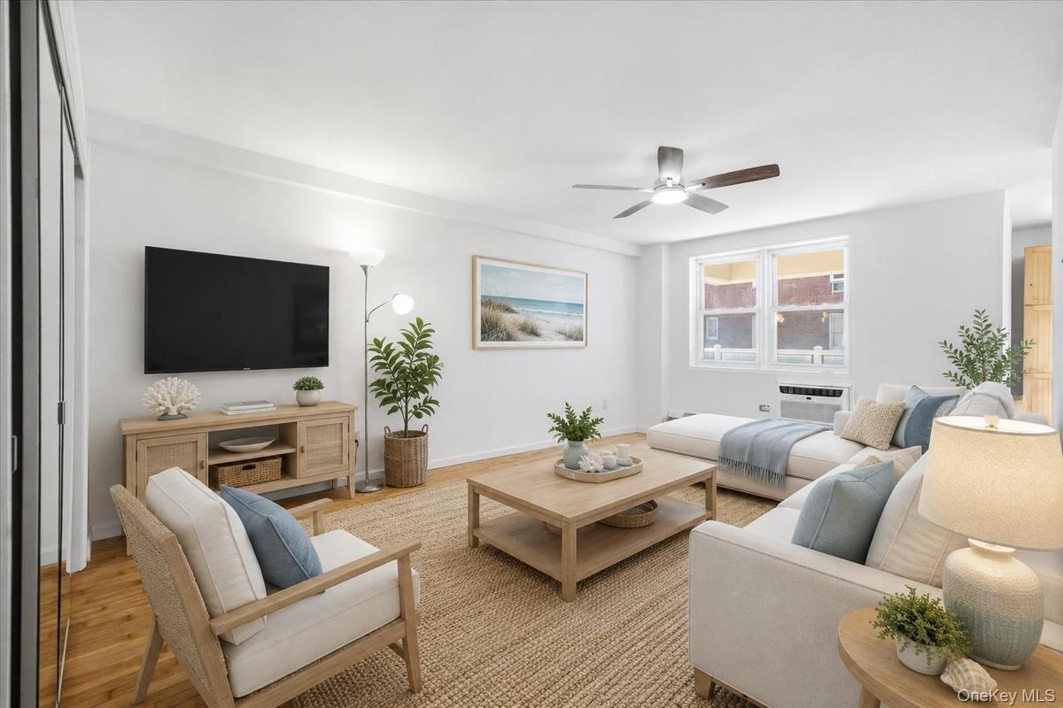 Refinished hardwood floors and fresh paint throughout Photo is virtually staged