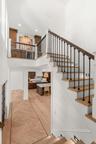 GRAND STAIRCASE TO LOFT FEATURING AUTOMATIC AMBIENT STAIR LIGHTING