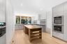 Kitchen featuring stainless steel appliances, modern cabinets, a center island, butcher block countertops, and recessed lighting