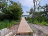 Bayfront lot's dock that home has access to. Bay front lot is available for separate sale.