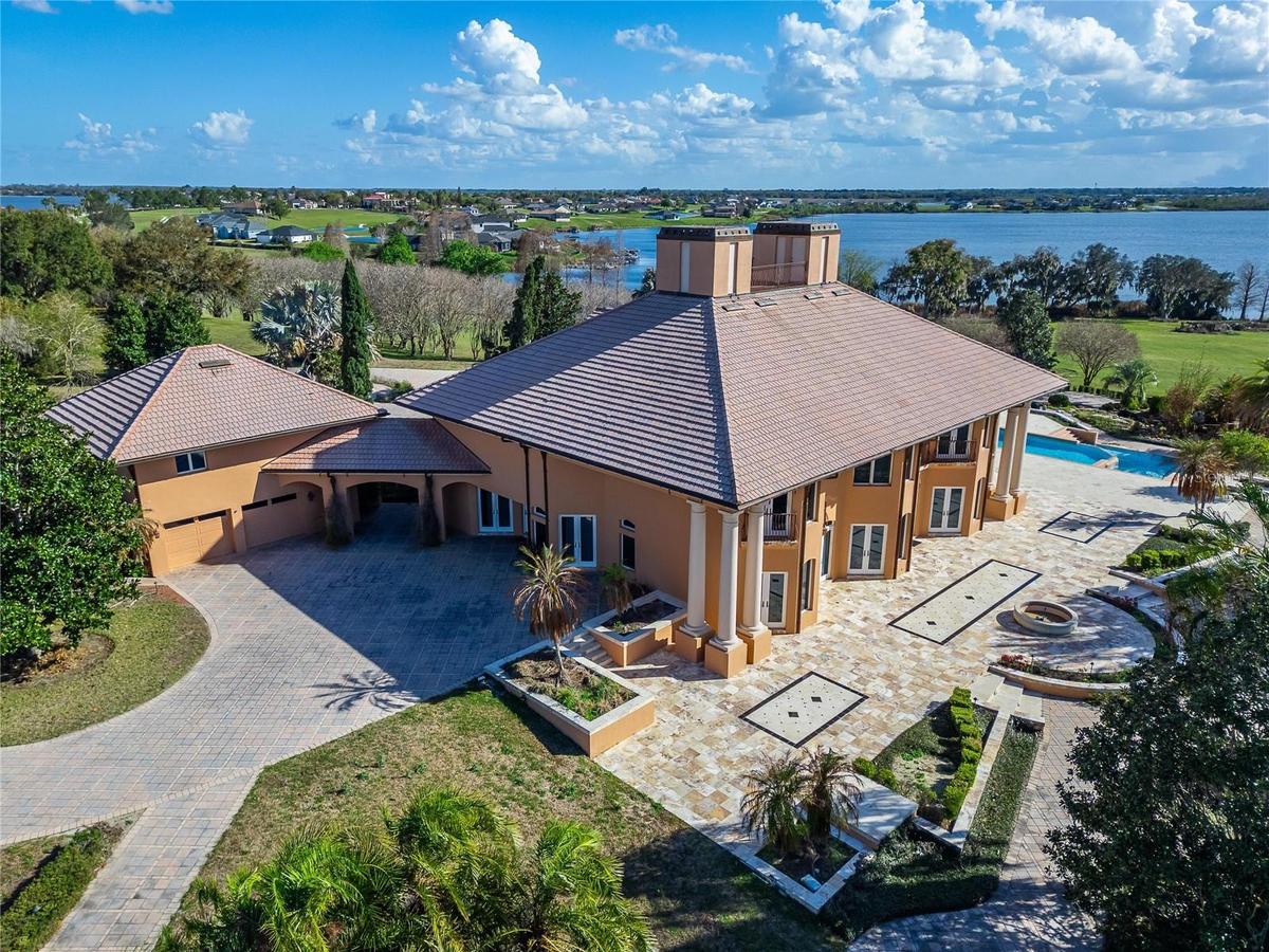 Completing the property are two separate two-car garages, including a beautifully finished main garage with tiled flooring and cherry wood walls and c