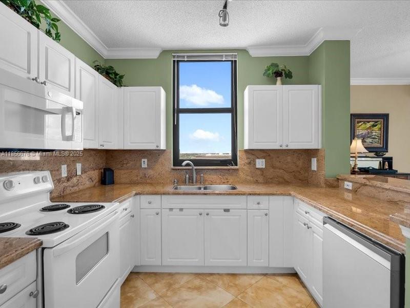Open Kitchen with updated cabinetry and matching appliances. Washer and Dryer inside the unit as well!
651 Okeechobee Blvd., Unit #1002, West Palm Be