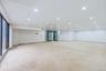 Empty room with concrete floors and recessed lighting