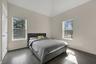 Bedroom featuring baseboards and wood finished floors