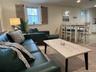 Living room featuring light wood-type flooring and recessed lighting