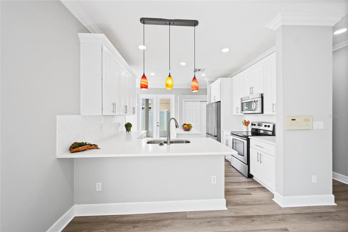 Breakfast bar adjacent to family room