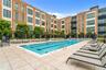 Community pool with a patio area