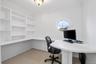 Unfurnished office with ornamental molding and baseboards