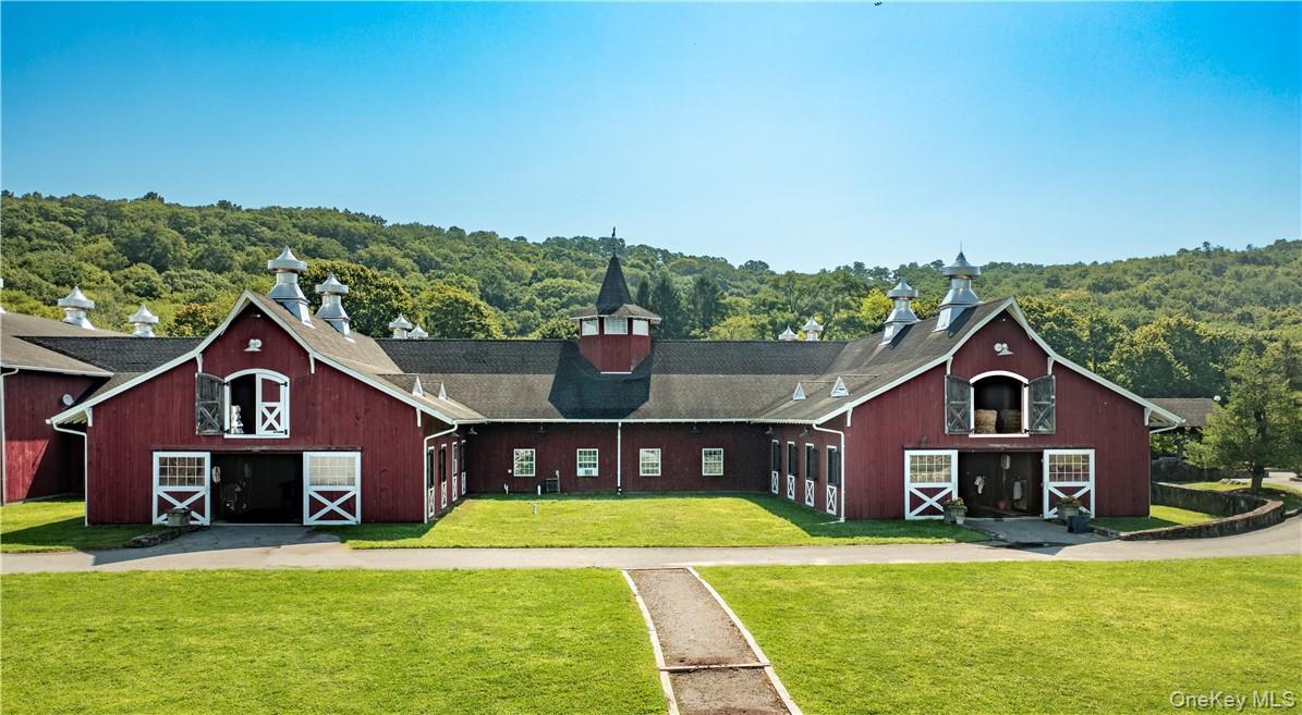 An exceptional equestrian estate set on 247 acres of Quaker Hill's finest countryside. The turnkey, multi-discipline, equestrian facility offers 4 bar