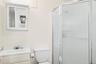 Full bathroom with a shower stall and vanity