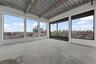 Spare room with concrete floors and a view of skyline