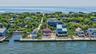 Waterfront property featuring a private boat slip, dock, and direct water access