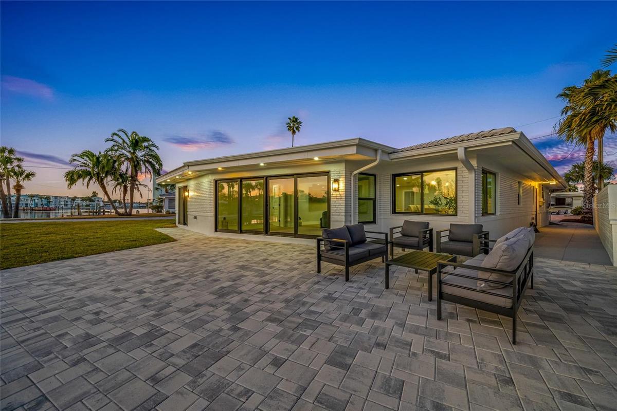 Sliding glass doors from living room and primary suite
