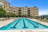 Community pool featuring a patio