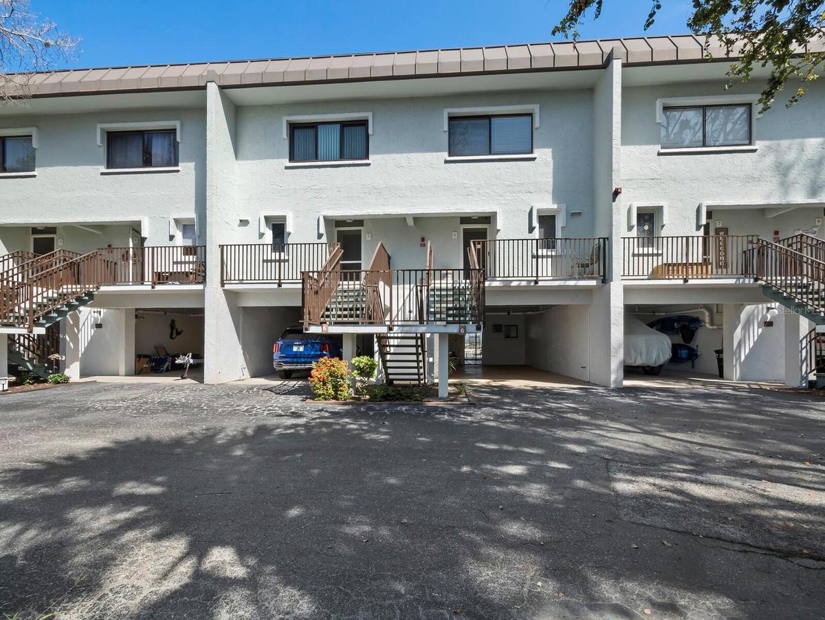 The home features a private, covered carport, bonus air conditioned room and a work shop on the ground floor. Walk up to your first level and be astou