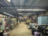 Garage with metal wall and a workshop area