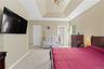 First Floor Recessed ceiling with layered trim, neutral wall color, and light-toned carpeting