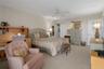 Primary bedroom offers a walk-in closet and an en-suite bathroom for added convenience