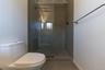 Bathroom featuring toilet and a tile shower
