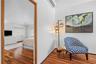One of the home's most unique features is the upstairs guest suite. Unlike many mezzanine spaces found in similar models, this residence offers a true