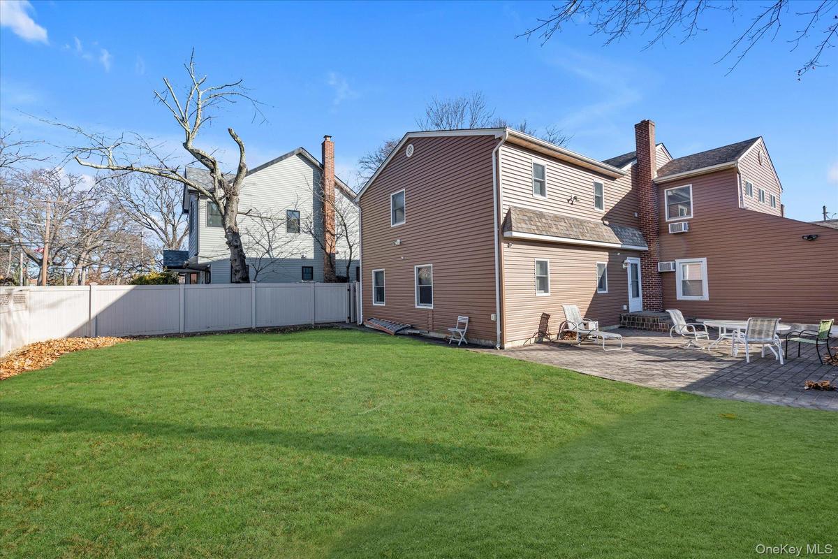 Back of property with a patio and entry steps