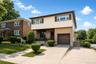 Two-story residence featuring a combination of brick and siding, an integrated single-car garage, and a concrete driveway