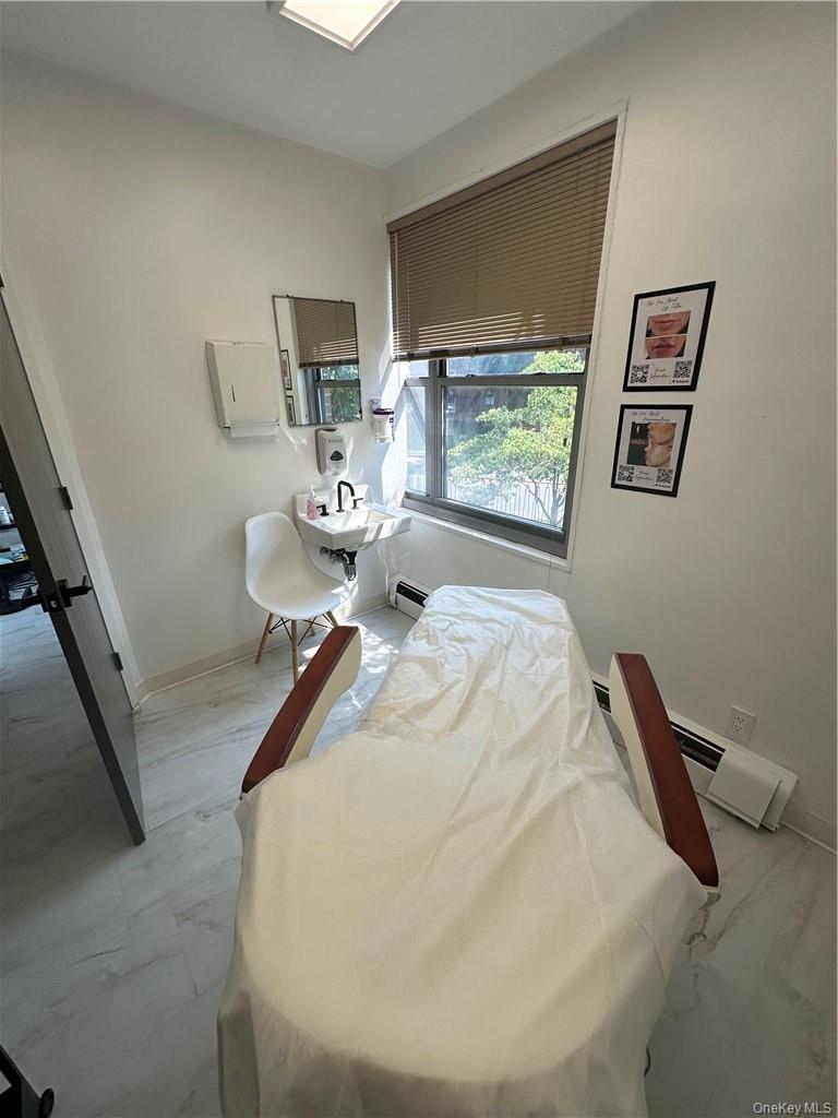 Bedroom featuring a baseboard radiator
