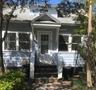 View of front of home featuring a shingled roof