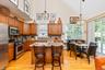 Kitchen featuring wood-finish flooring and vaulted ceilings