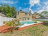 Backyard showing pool & house