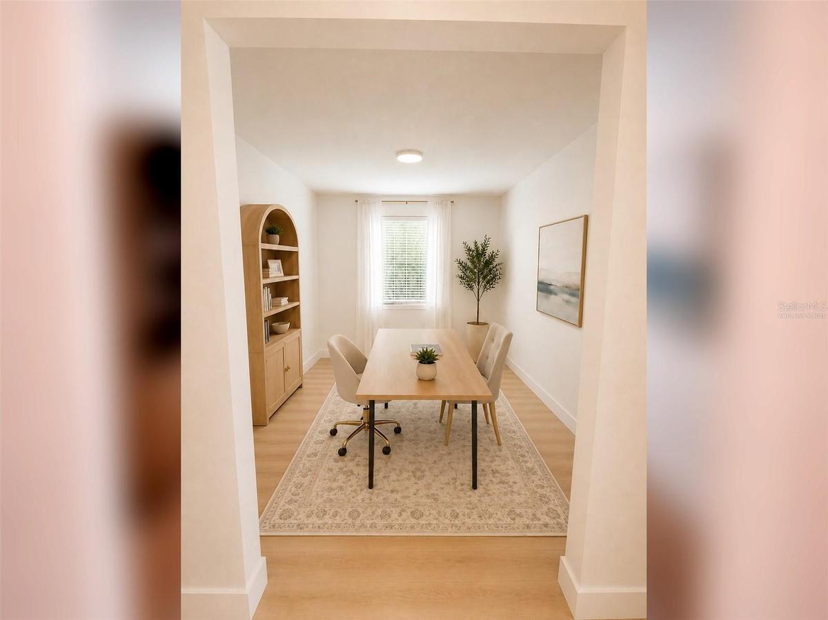 14048 Larkspur Lake Dr - Spacious open flex room, ideal for a formal dining room, home office, or additional living space. Virtually staged.