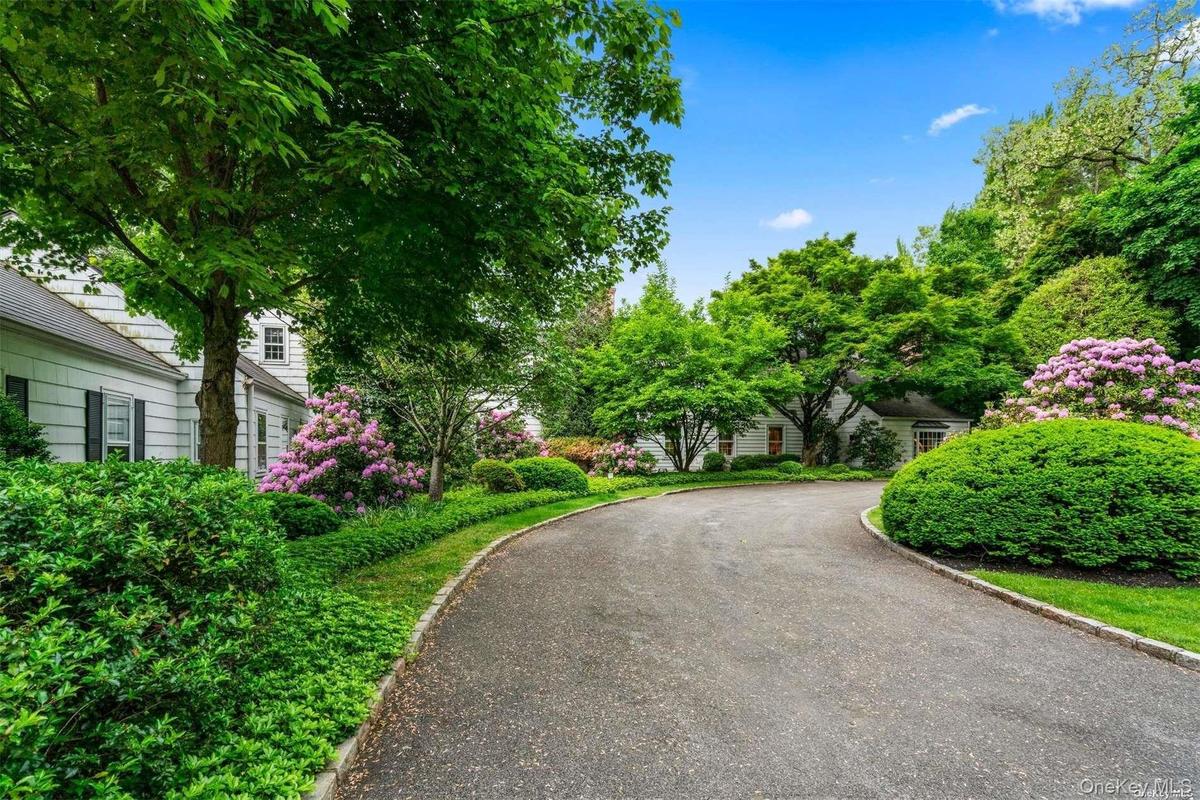 Front Exterior with Flowering Shrubs at Entrance