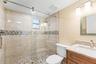 Second bathroom, updated with new countertop, flooring, and paint.