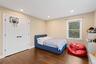 Bedroom featuring wood finished floors, recessed lighting, and a closet