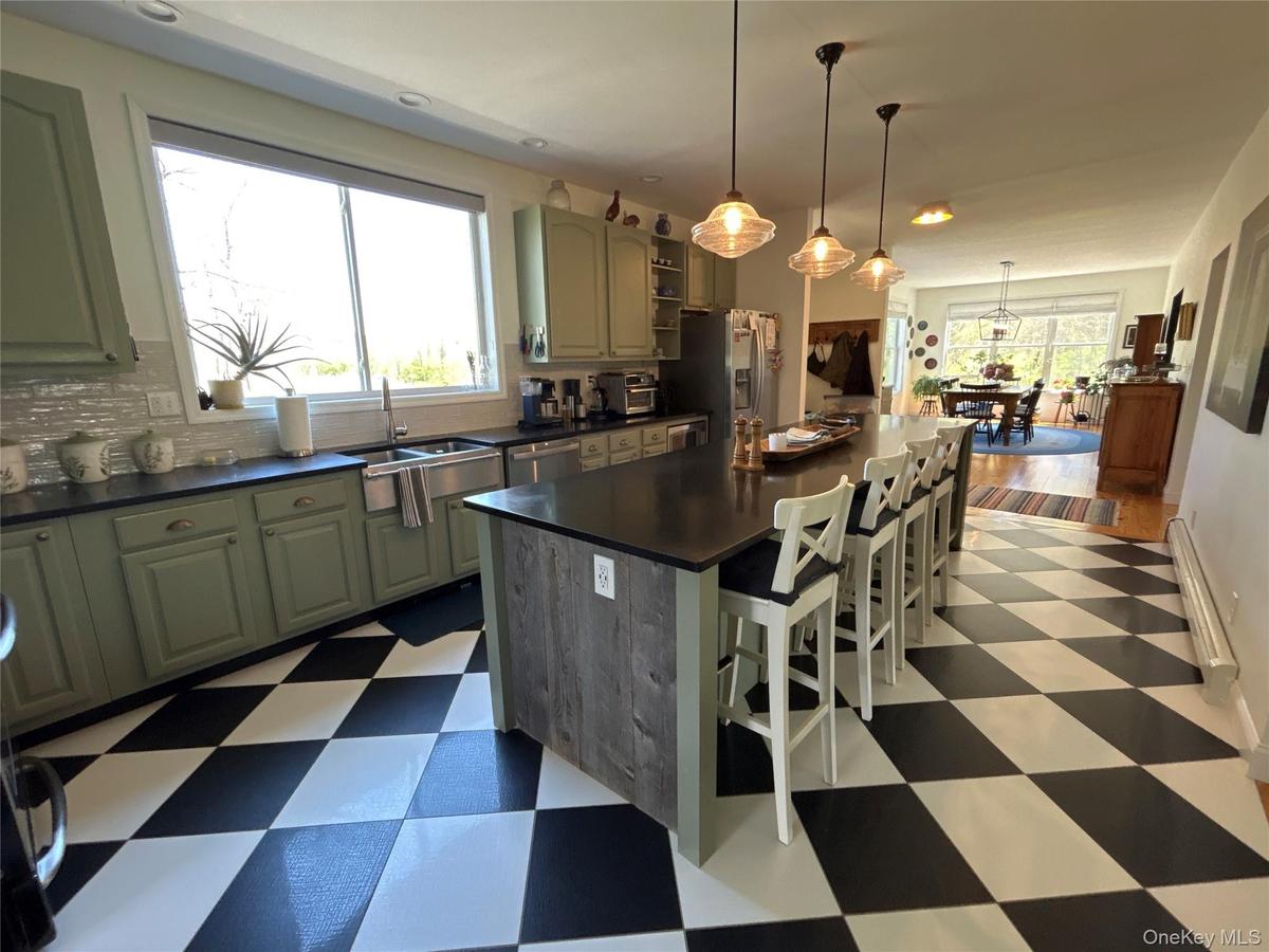 View of kitchen looking into dining area