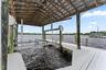 dock with and boat cover and a 12,000 lb lift