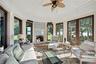 Sunroom / solarium with a decorative wall