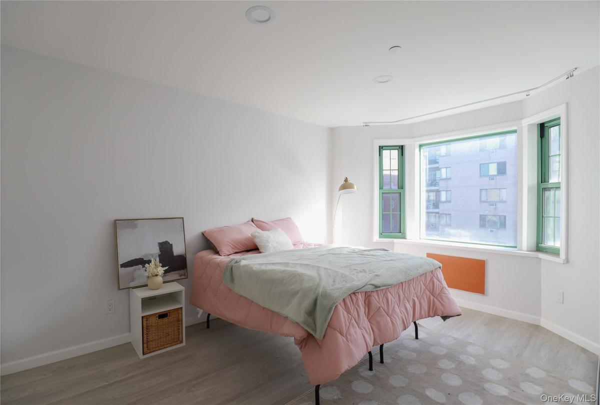 Bedroom with wood finished floors