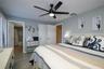 Primary bedroom on first floor with ensuite bathroom and a large walk in closet