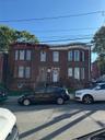 View of front facade featuring brick siding